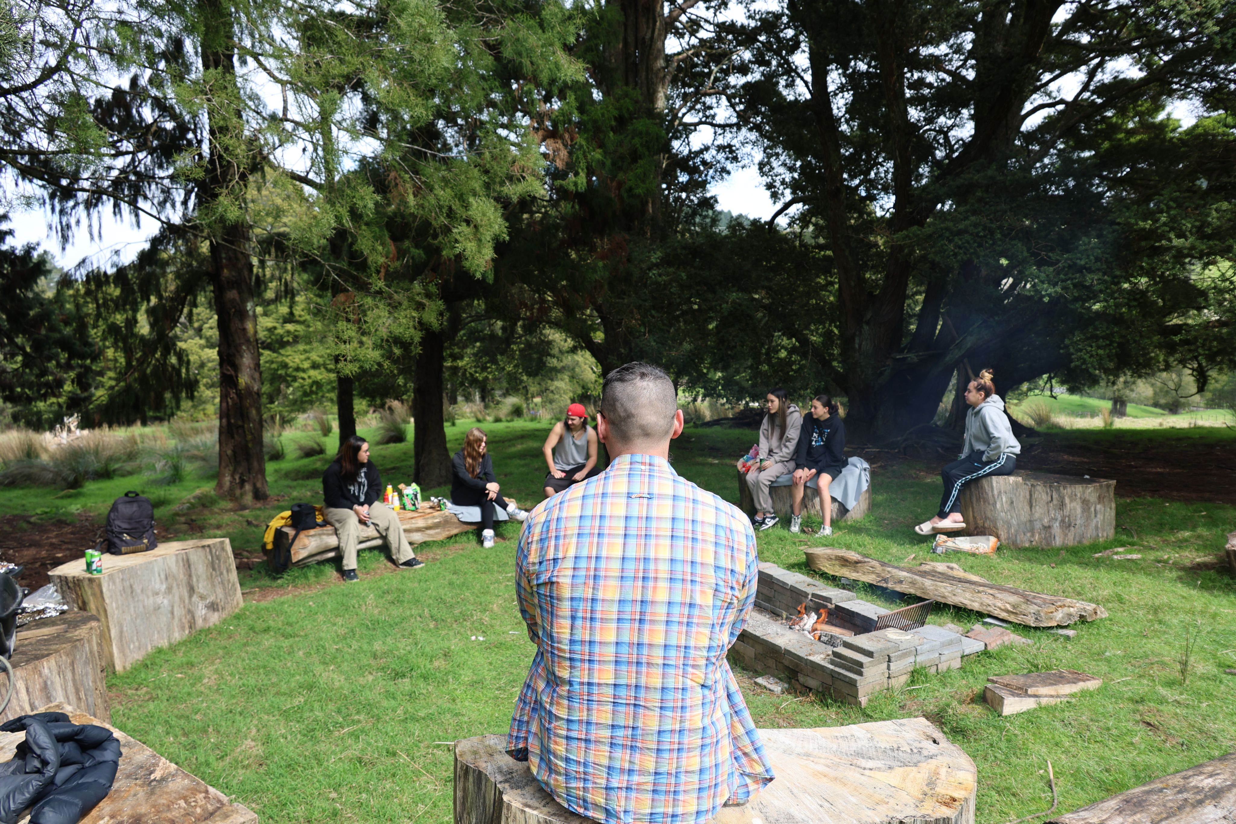 An artist's hand blends vibrant watercolors during a relaxing indoor painting session.